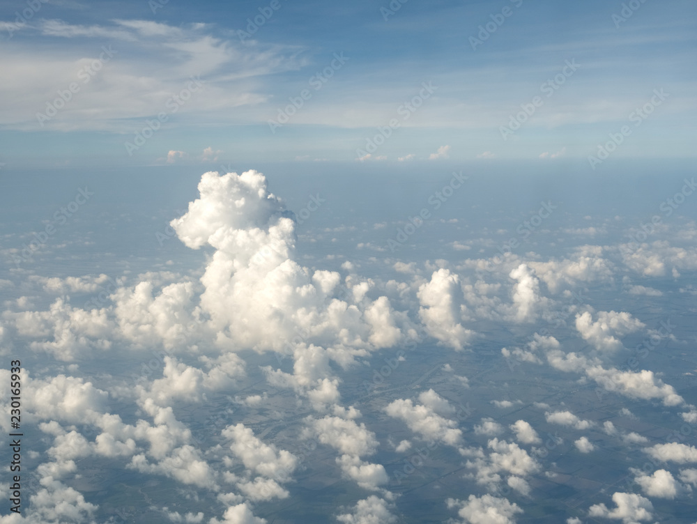 An aerial view of clouds and skies and fields from an airplane (flying over Southeast Asia - Thailand, Vietnam) An aerial view of clouds and skies and fields from an airplane (flying over Southeast Asia - Thailand, Vietnam)
