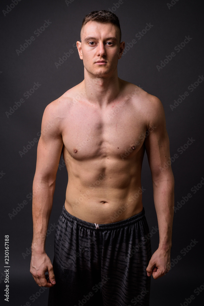 Portrait of young handsome muscular fitness man shirtless Portrait of young handsome muscular fitness man shirtless
