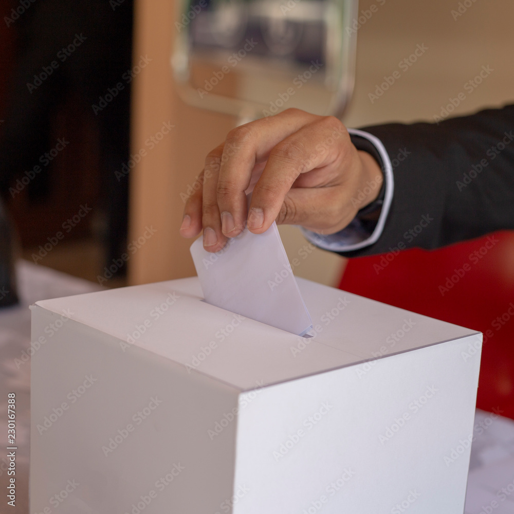 a man put white paper in election box a man put white paper in election box