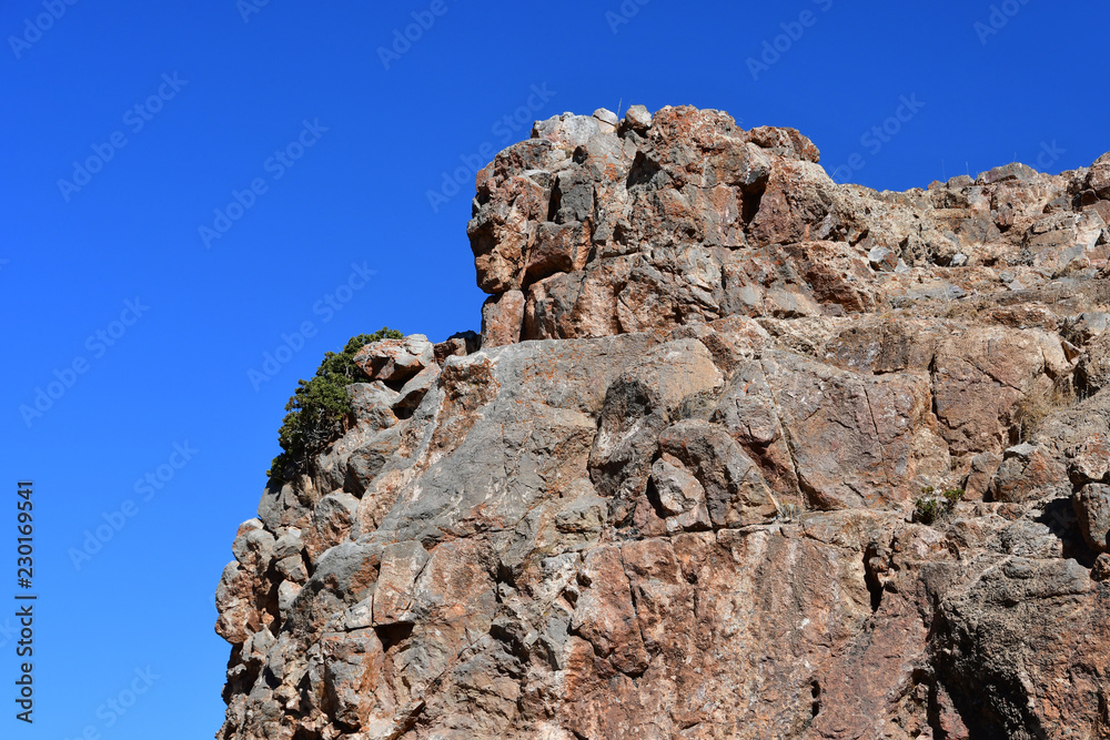 Tibet, one of the geoglyphs on rock on the shore of the sacred lake Nam-Tso (Nam Tso) against the blue sky, 4718 meters above sea level Tibet, one of the geoglyphs on rock on the shore of the sacred lake Nam-Tso (Nam Tso) against the blue sky, 4718 meters above sea level