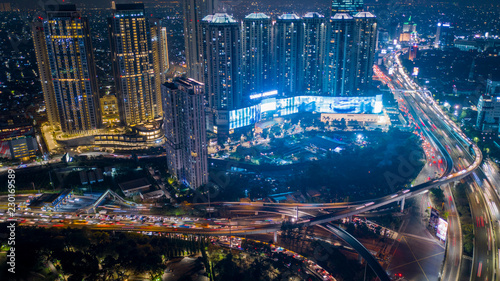 Night scenery of high buildings with traffic jam