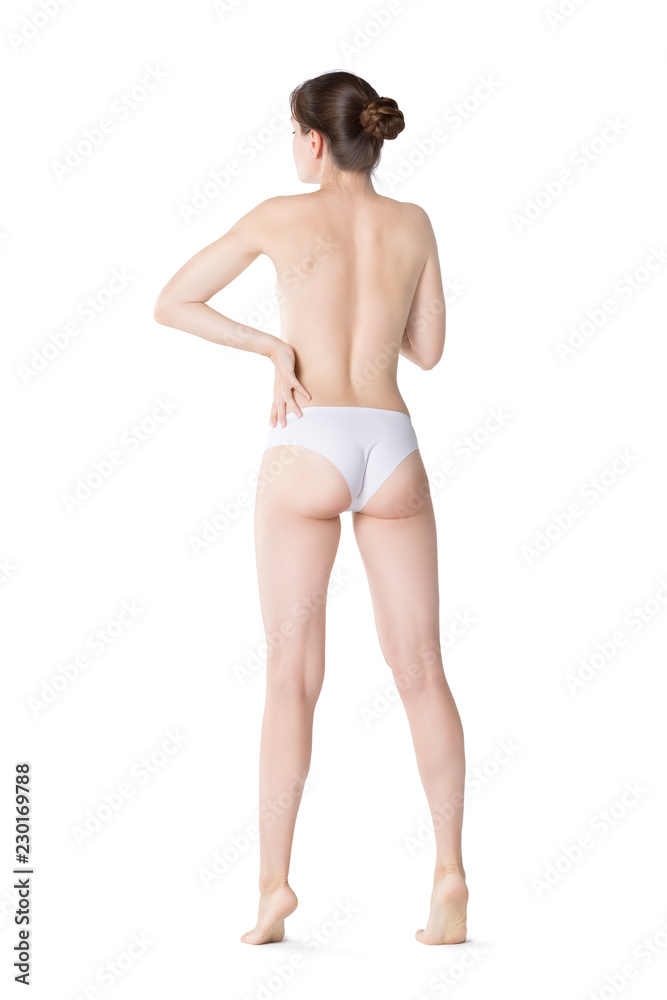 Naklejka premium Slim woman topless in white panties isolated on white background, perfect female body