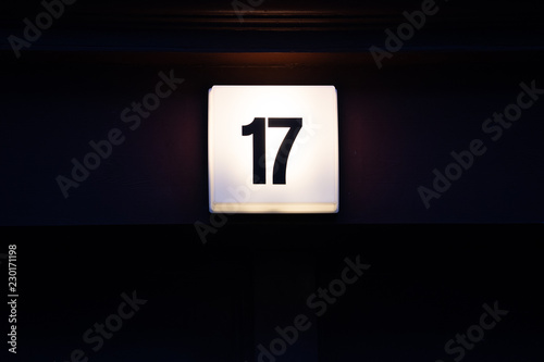 House Number with Digit 17 on a Lamp