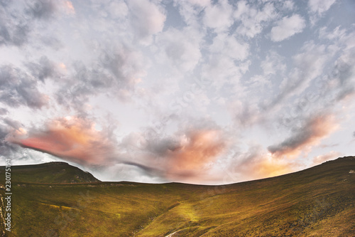 Sunset mountains and clouds sky landscape travel nature background awesome tranquil evening scenery