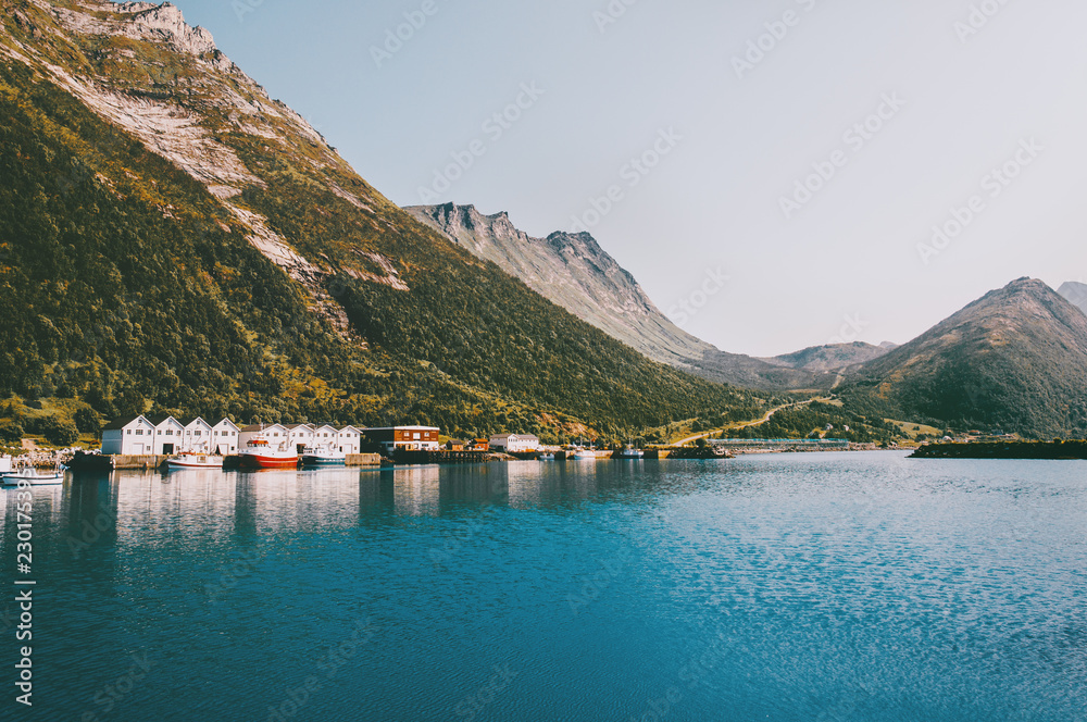 Husoy village in Norway mountains and sea fjord landscape Travel locations scandinavian scenery Senja islands