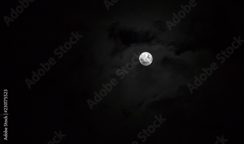 Photography Full moon with dark clouds in the night sky