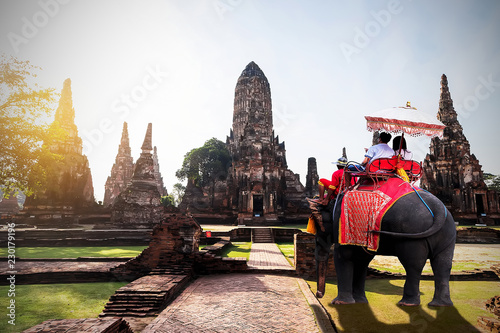 Foreign tourists Elephant ride to visit Ayutthaya, There are ruins and templesi in the Ayutthaya period.Concept is Travel in temple Chaiwatthanaram.