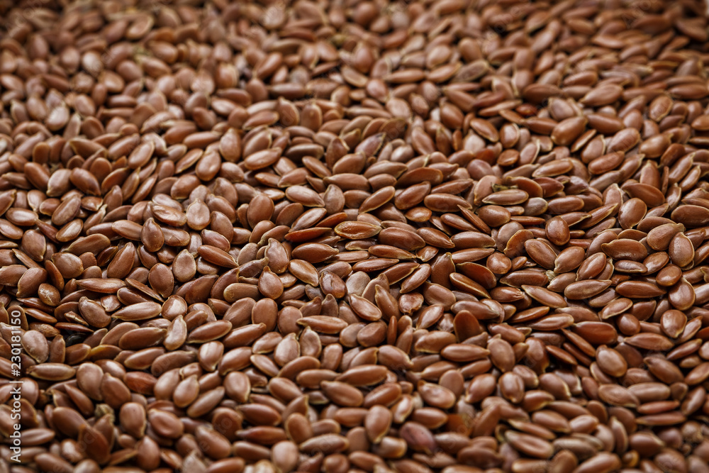 Background texture of seeds of dark brown flax. Background texture of seeds of dark brown flax.