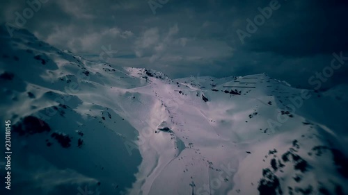 Scenic winter aerial flight of drone over the mountains and ski resort. Beautiful panorama, sunny day on ski resort. Kaltenbach, Zillertal,  Austria. 4K. photo