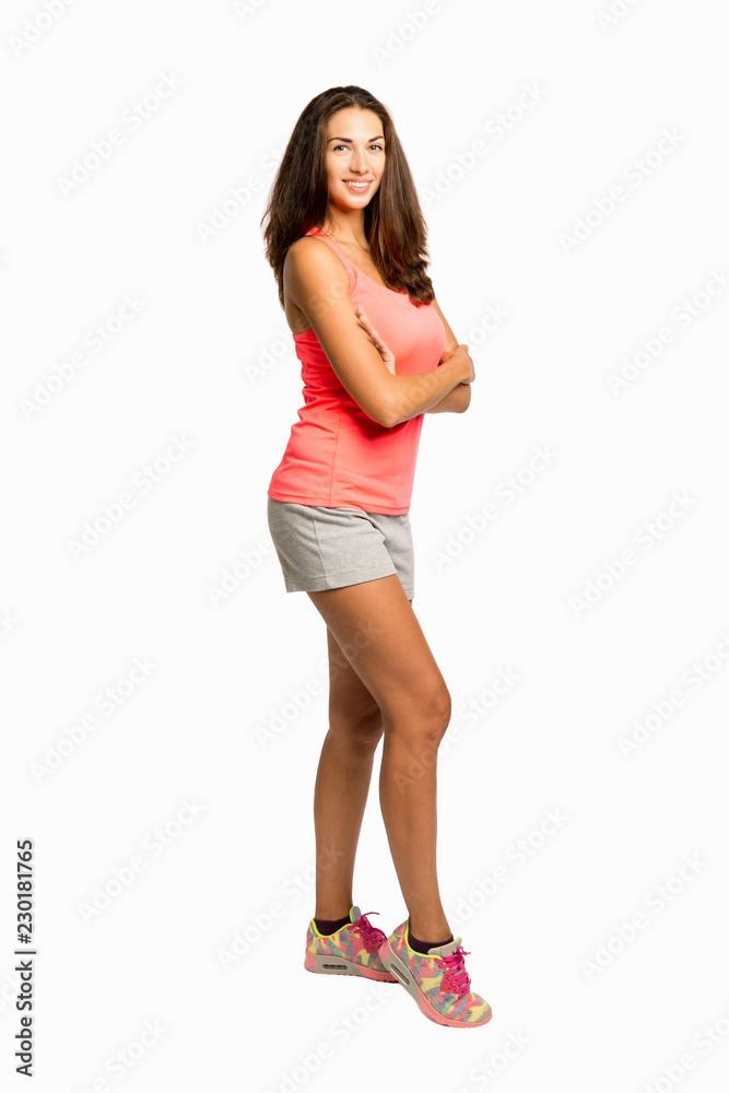 Beautiful young woman in sportswear in full growth Beautiful young woman in sportswear in full growth