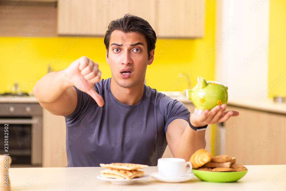 Young man in unhealthy food concept Young man in unhealthy food concept