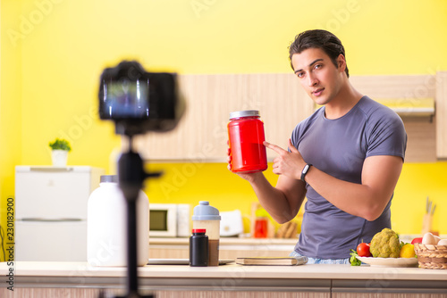 Young man blogging about food supplements