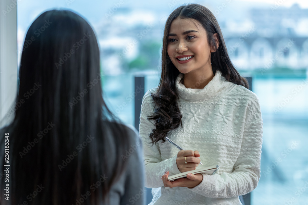 Asian woman professional psychologist doctor giving the consult to female patients in modern living room of house or hospital exam room, Mental health Concept