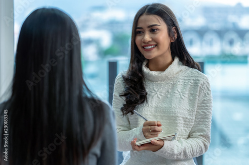 Obraz na płótnie Asian woman professional psychologist doctor giving the consult to female patients in modern living room of house or hospital exam room, Mental health Concept w salonie
