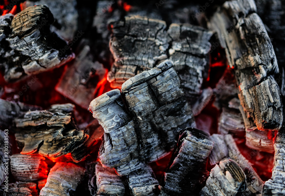 Burning coals of wood as a background