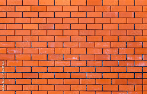 Wall from a red brick as a background