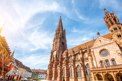View from below on the main cathedral in the old town of Freiburg, Germany photo