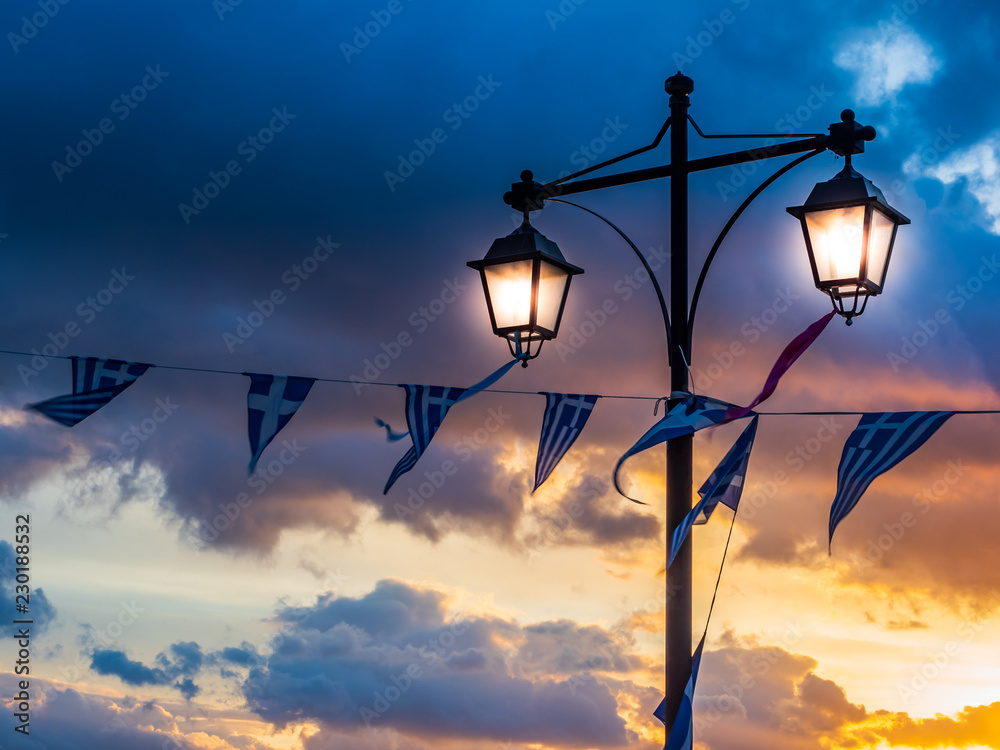 National Greek flag on beautiful sunset clouds