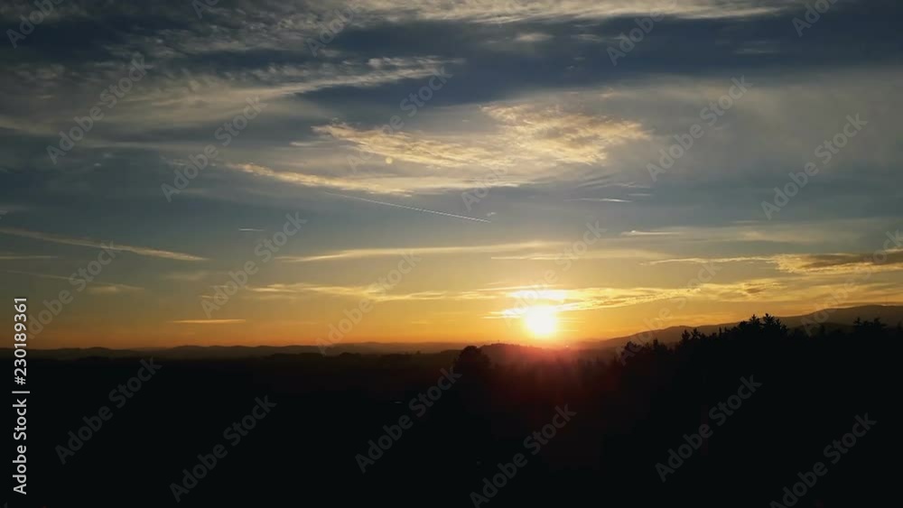 Sunset cloud time lapse with land silhouette Sunset cloud time lapse with land silhouette