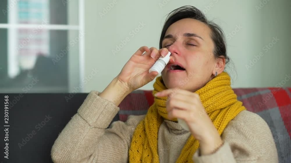Sick Young Woman Using Nasal Spray Sick Young Woman Using Nasal Spray