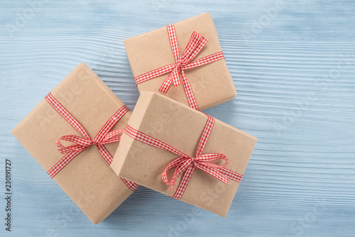 Paper gift boxes on blue background 