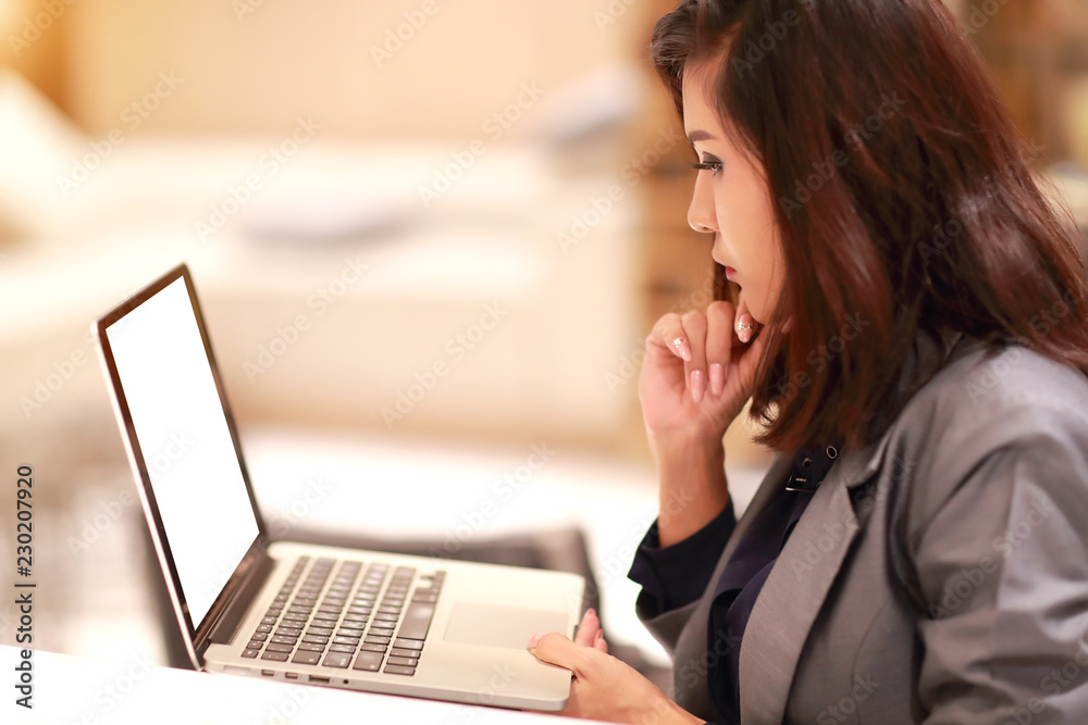 working and charming woman with glasses using laptop computer (work from home concept) working and charming woman with glasses using laptop computer (work from home concept)