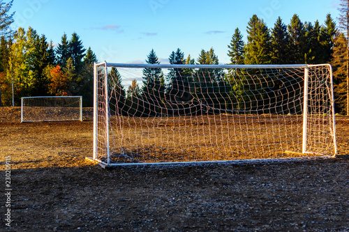 Old football goals on football field in autumn © Sergei Gorin