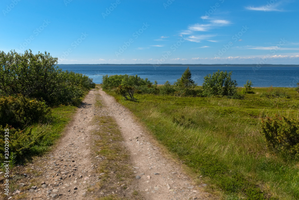 Rural road - the gauge goes along the White Sea on Anzersky Island