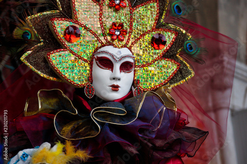 Colorful carnival multicolor mask and costume at the traditional festival in Venice, Italy