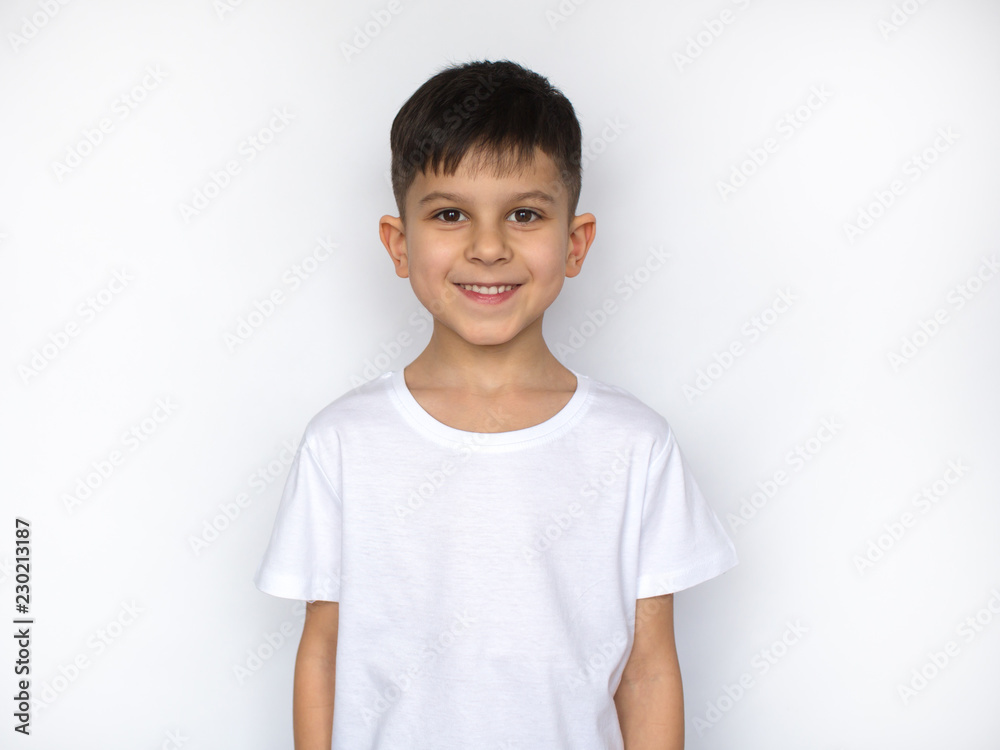 little smiling boy in white t-shirt isolated on white little smiling boy in white t-shirt isolated on white