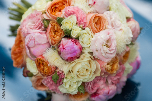Wedding beautiful bridal bouquet of natural flowers, closeup with blurred background