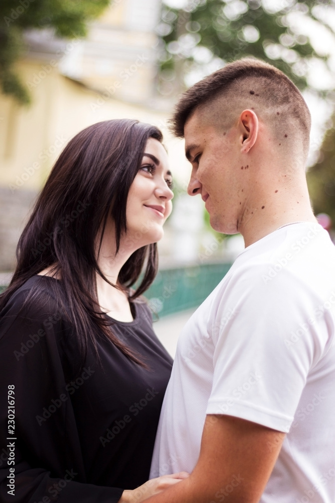 The girl and the guy look at each other for a walk