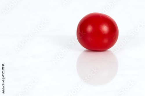 Cherry Tomato against a white background