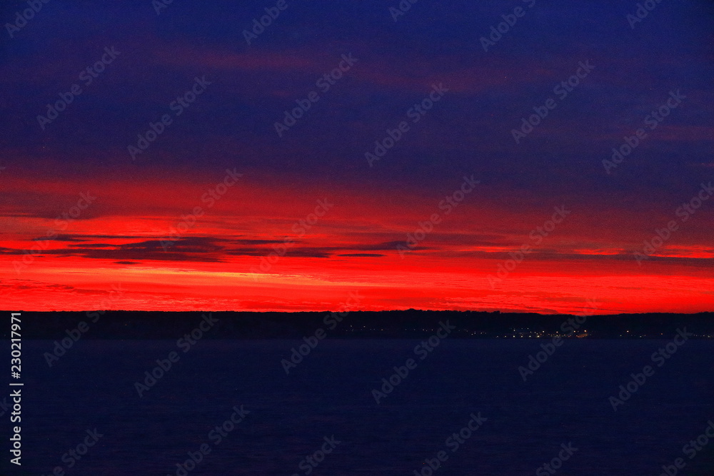 A color image of a sunset over the North Sea as seen from the balcony of a cruise ship.