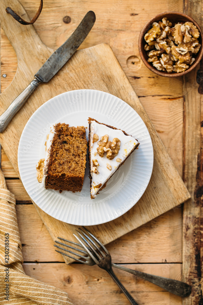 Carrot Cake with Cream Cheese Icing and walnut. Vegan and gluten free concept