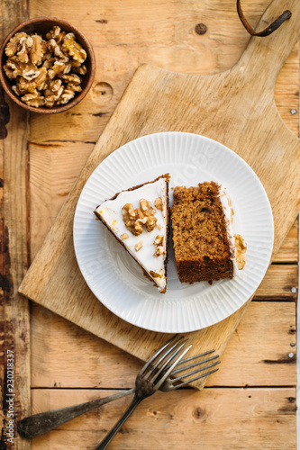 Carrot Cake with Cream Cheese Icing and walnut. Vegan and gluten free concept