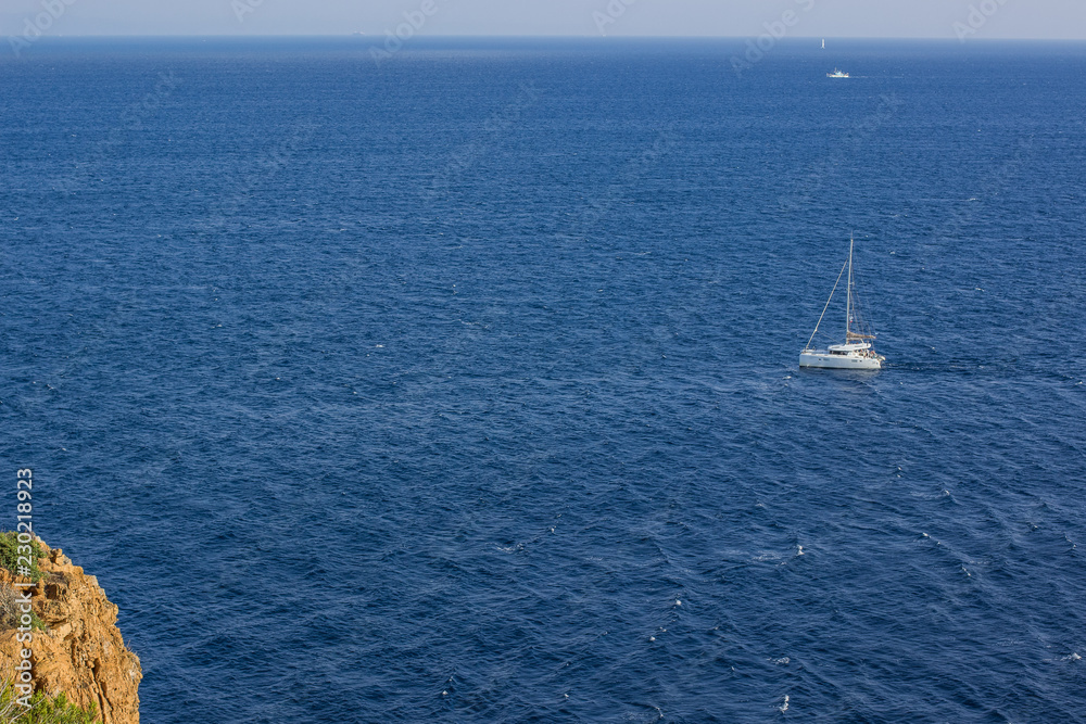 expensive vacation concept of reservoir scenic nature landscape and small yacht in tropic warm south sea water surface, foreshortening from above, copy space 