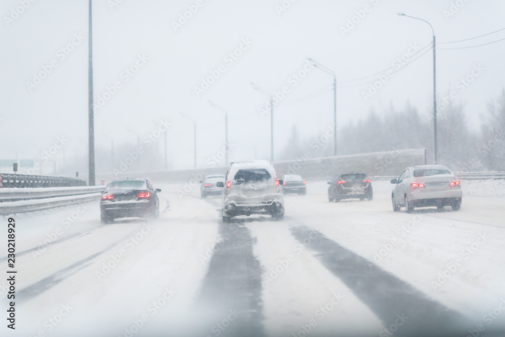 Winter Storm Traffic. Highway During Snow Storm. Heavy Snowfall and Heavy Traffic.