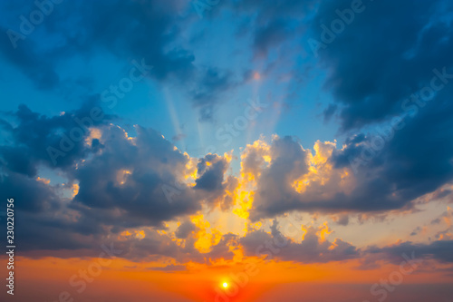 dramatic sunset on a dense cloudy sky