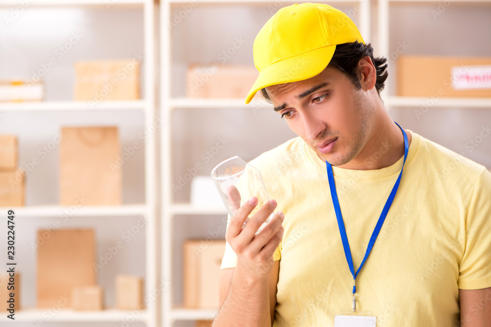 Handsome contractor working in box delivery relocation service Handsome contractor working in box delivery relocation service