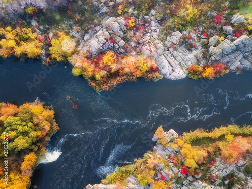 aerial drone view of colorful forest  blue river and rocks. beautiful autumn landscape