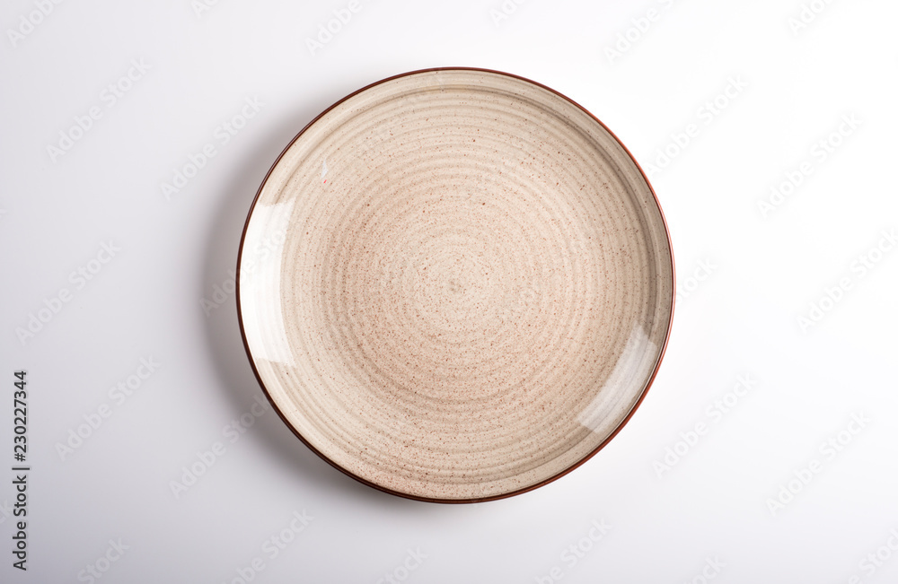 Empty dish isolated on a white background. Top view. Empty dish isolated on a white background. Top view.