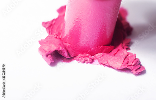 Wallpaper Mural A bright pink lipstick being smashed onto a white background showing texture.  Shallow depth of field.  Horizontal image. Torontodigital.ca