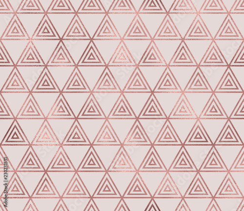 Sparkle geometric seamless pattern with rose gold triangular foil texture. Trendy glitter wallpaper. Modern premium chic background.