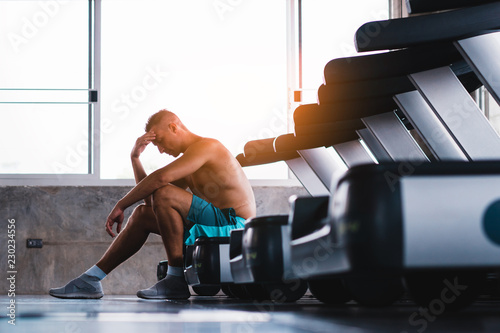 Upset man in the fitness after bad running results