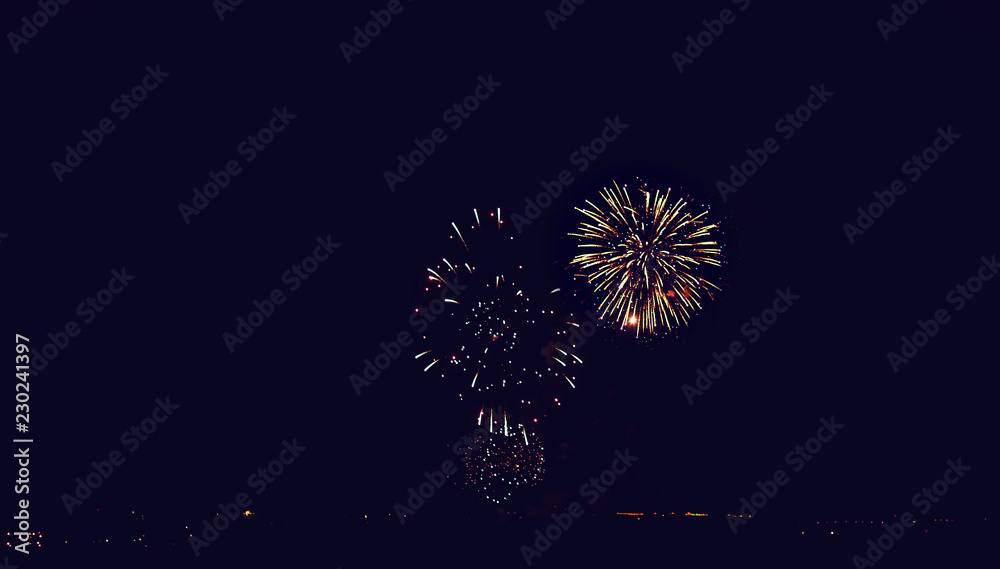 Fireworks at New Year or christmas with copy space - abstract holiday background Fireworks at New Year or christmas with copy space - abstract holiday background