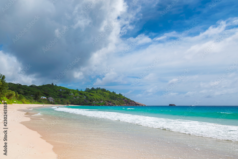 Untouched sandy beach with beautiful rocks and turquoise sea in Paradise island. 