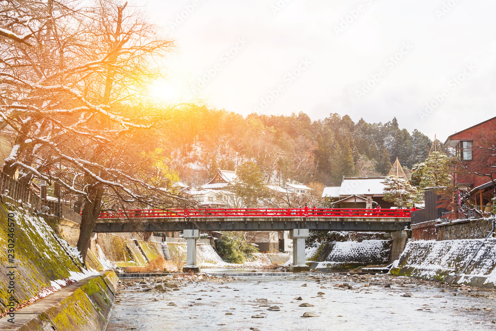 Red Nakabashi bridge the entrance to historic old town, a tourist destination in city of Hida Takayama in Gifu Prefecture, Japan at sunrise.