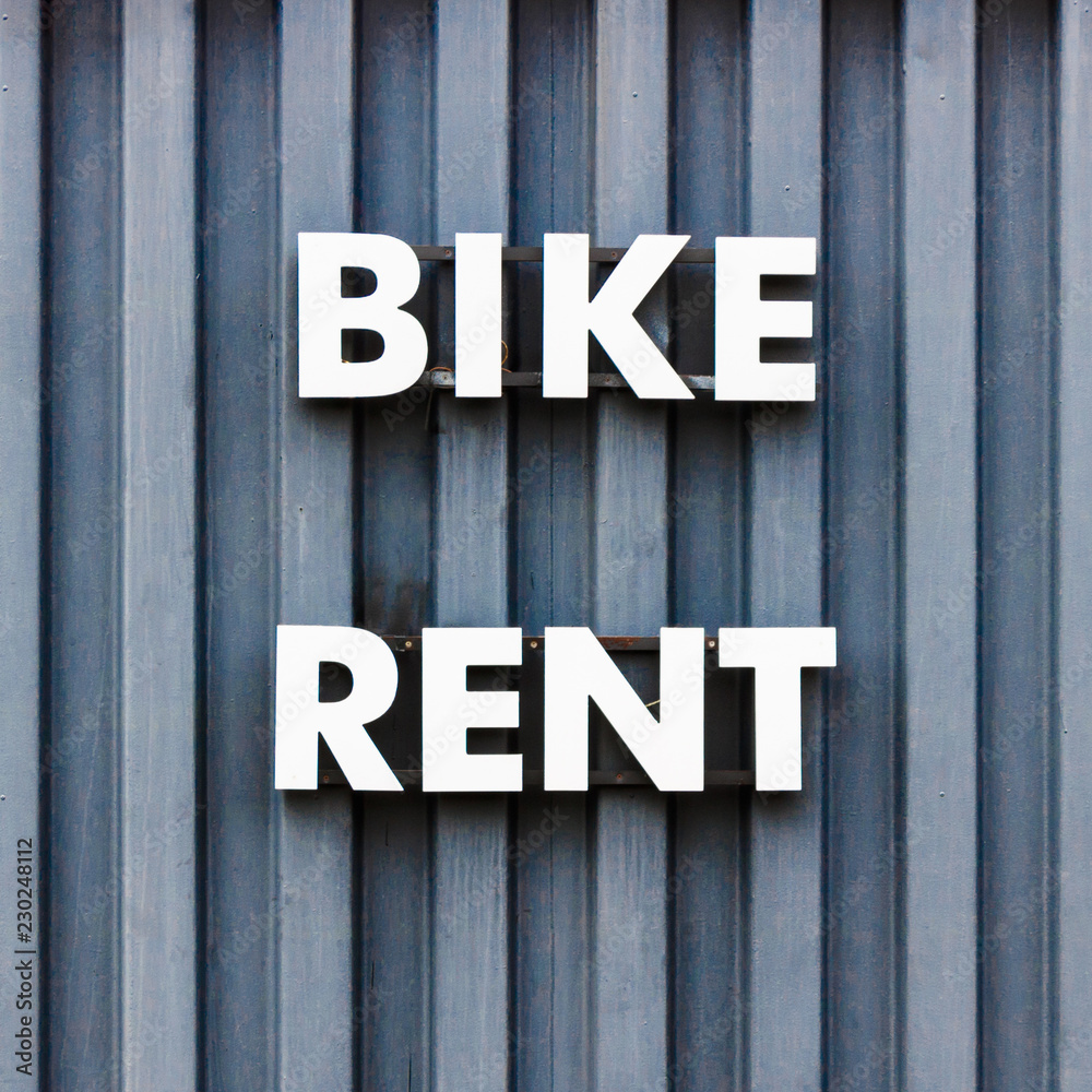 bicycle rental, writing on the wall bicycle rental, writing on the wall