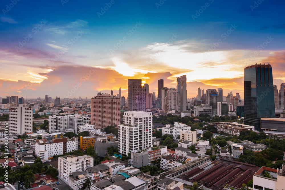 cityscape Bangkok sunset skyline, Thailand. Bangkok is metropolis and favorite of tourists live at between modern building / skyscraper, Community residents